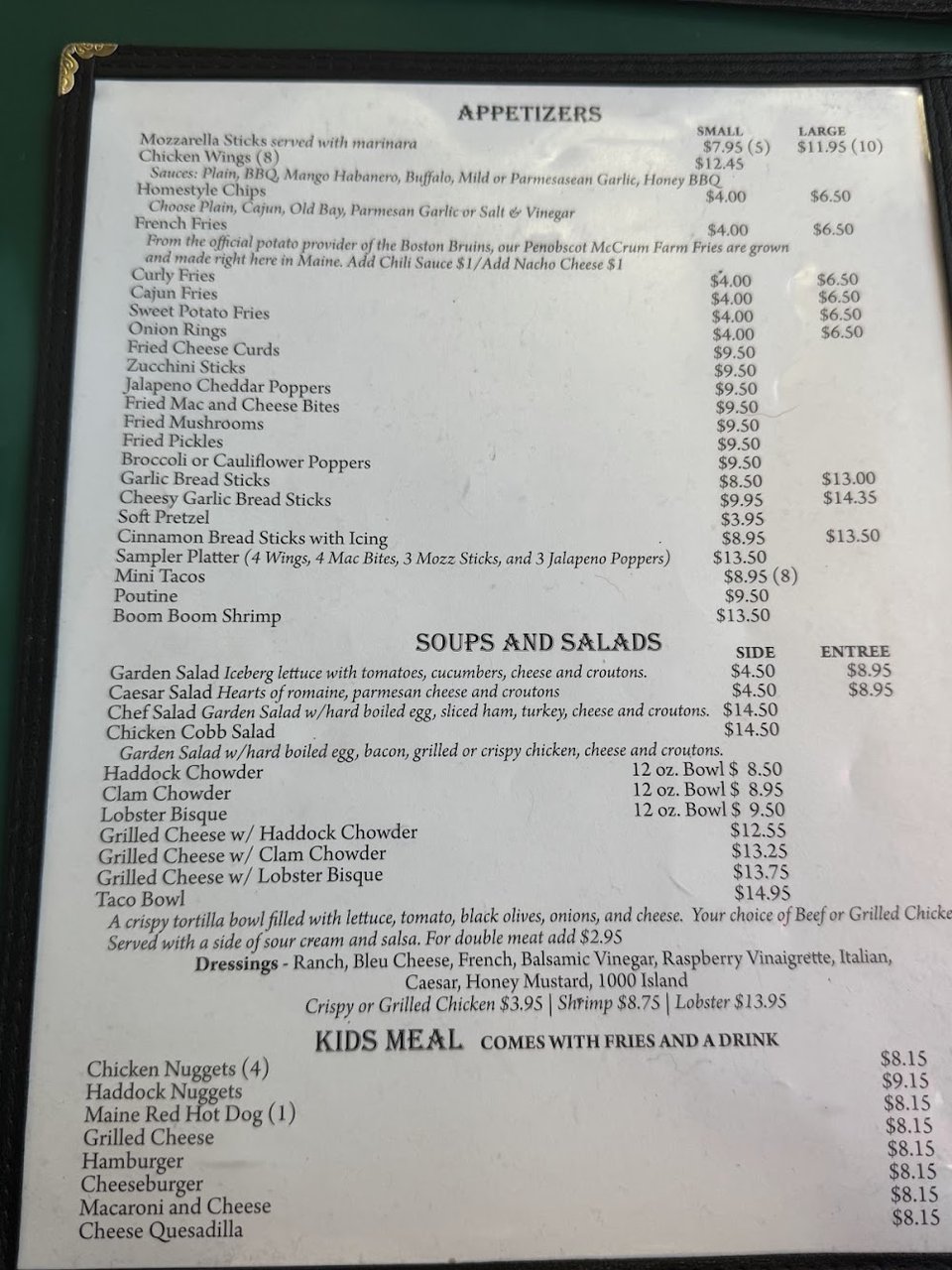 Menu board showing lobster rolls and calzones.
